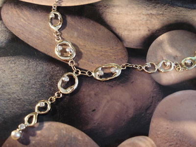 Long molten solid 9ct gold links, with round brilliant-cut diamonds sprinkled through links, necklace