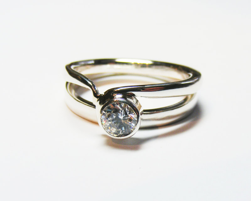 platinum & diamond shaped single stone ring