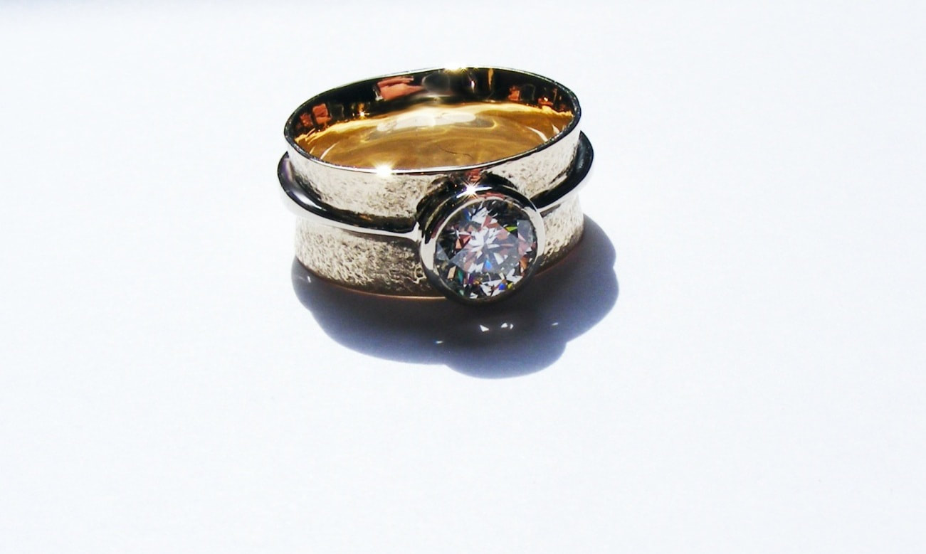 Barrel shaped, coloured diamond, wide band ring