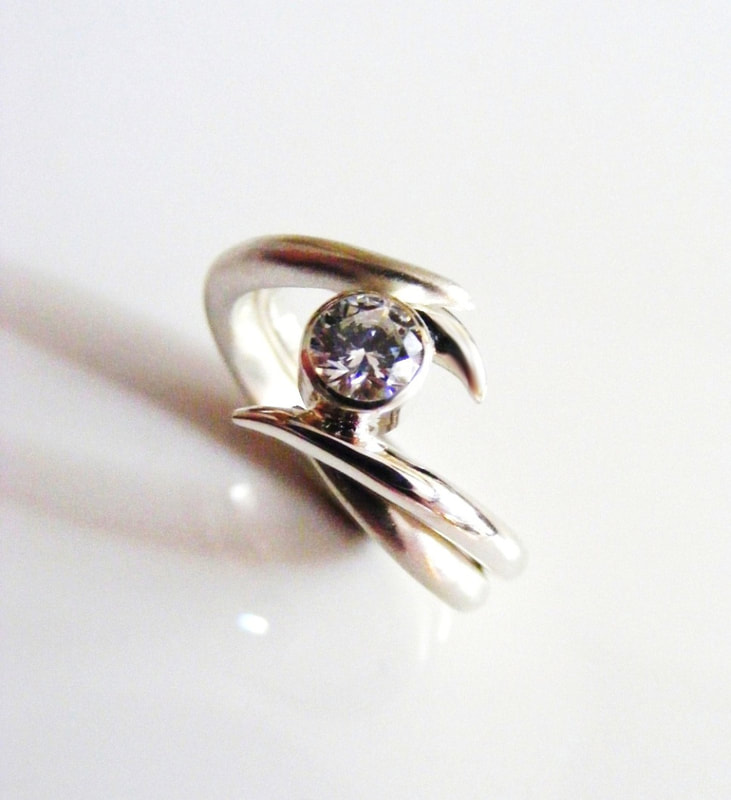 Entwined platinum & diamond ring