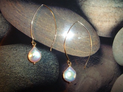 Elegant long gold Earrings with large natural coin pearl drops