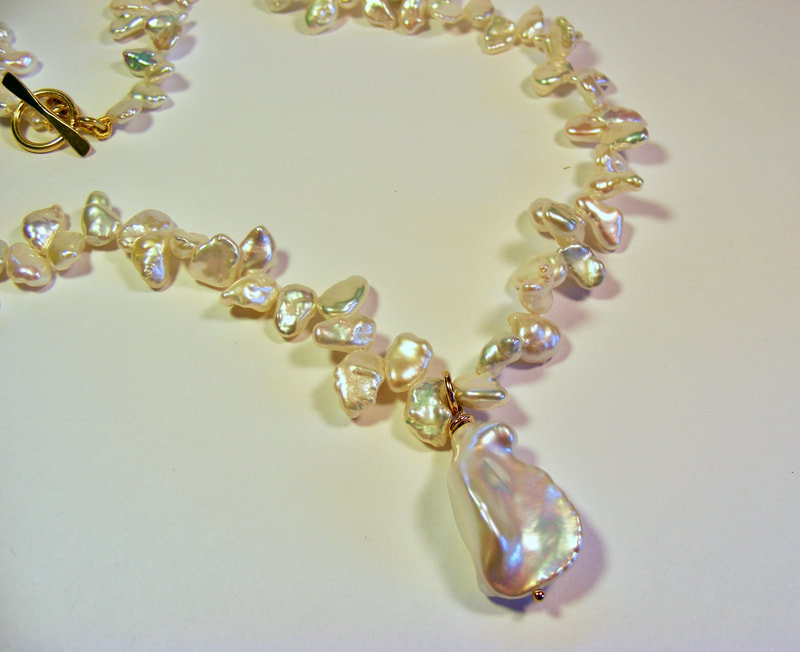 Keshi pearl necklace with flameball pendant
