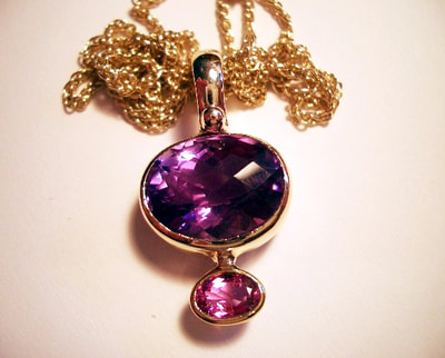 Huge natural facetted Ameythst, with natural pink sapphire, set in heavy 9ct gold pendant setting on heavy long gold cahin