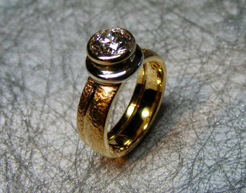 hero textured gold ring with bold rubover setting diamond
