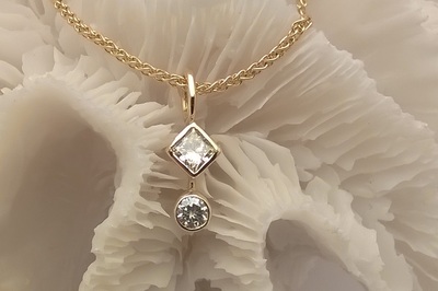 Natural white, square-cut, conflict-free Diamond, set in 18ct gold with natural round brilliant-cut conflict-free diamond droplet, on gold spiga chain. 